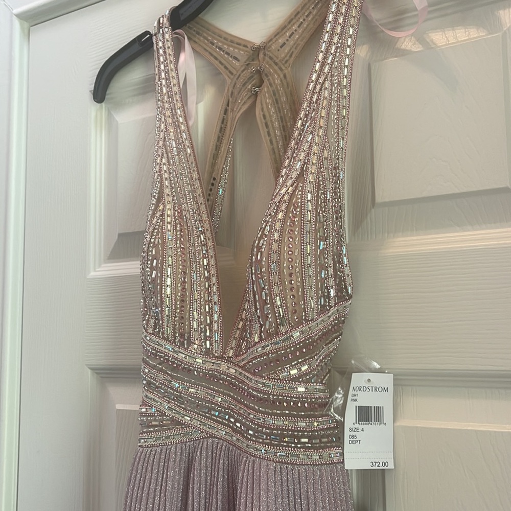 Formal Dress. Brand new never worn. Size 4. Color- Lilac
